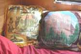 Vintage souvenir pillows in 1948 Boles Aero Trailer bedroom